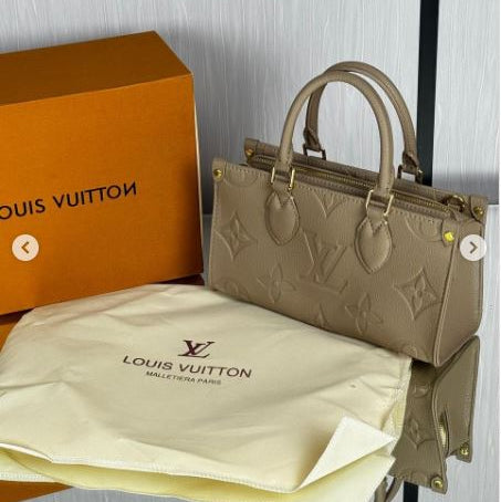Lv Onthego East West Monogram Reverse Hand Bag